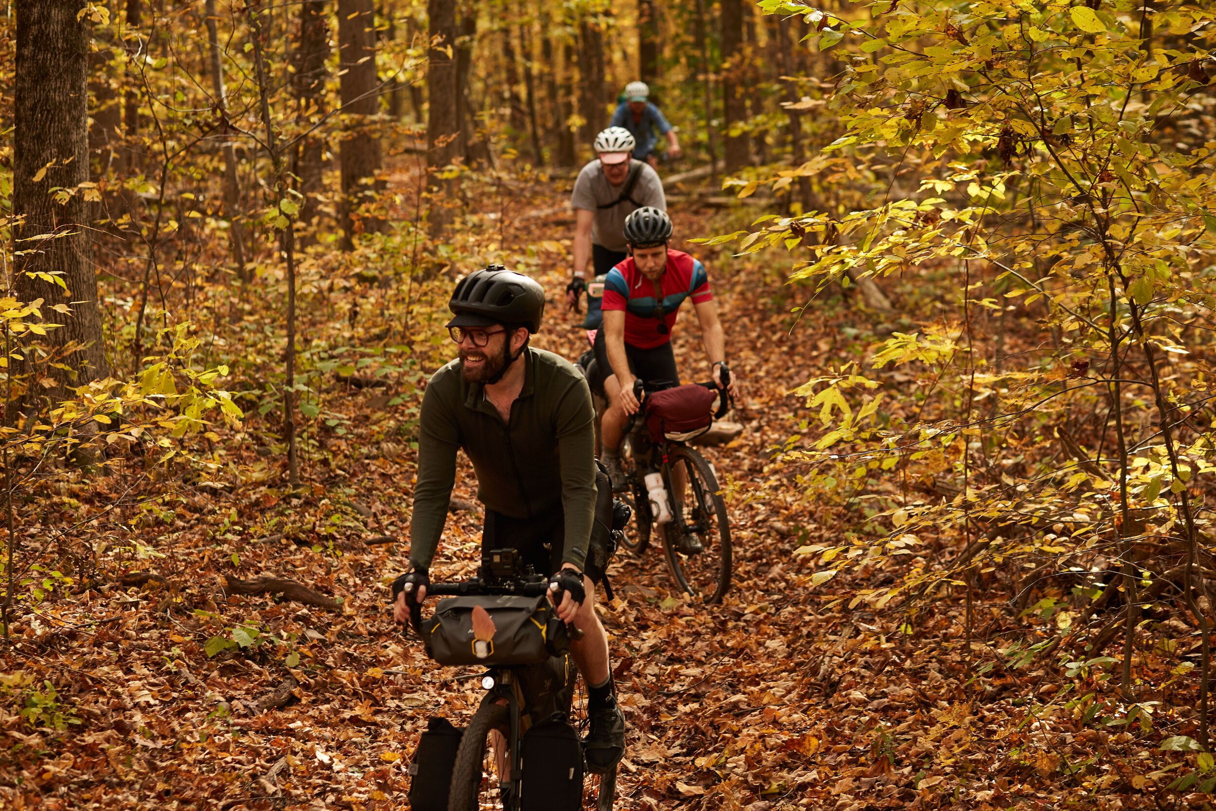 Three riders on a fall gravel trail
